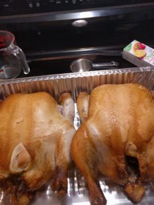 smoked chickens in a steam table pan